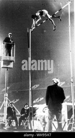 Japan, Tokyo Olympic Games, 1964: Fred M Hansen of USA, winner of the gold medal in the pole vault competition is shown with the winning jump of 5.10 metres. Stock Photo