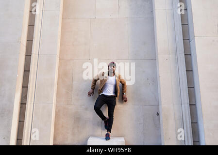 Mid adult man posing like a scupulture Stock Photo