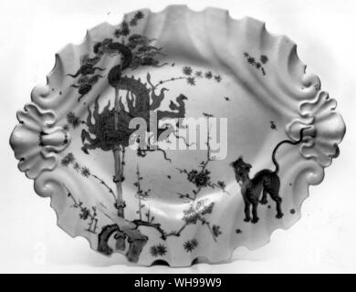 Chelsea 'red anchor' dish copying the Kaklemon design on illus. 77 (now called the Jabberwocky pattern) on a shape derived from silver Stock Photo