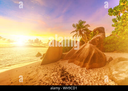 Rocks on beach and palm trees, Anse Source d'Argent at sunset, La Digue, Seychelles, Indian Ocean, Africa Stock Photo