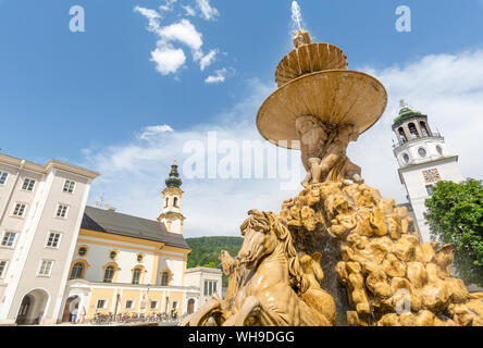 View of Baroque Fountain and Salzburger Glockenspiel in Residenzplatz, Salzburg, Austria, Europe Stock Photo