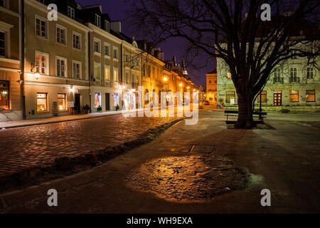 Houses along atmospheric Freta Street at New Town Square at night, Warsaw, Poland Stock Photo