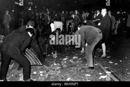 Paris riots, 25th May 1968: Police ordered to get even tougher as students tear up cobblestones from the streets to use as missiles against the police. Stock Photo