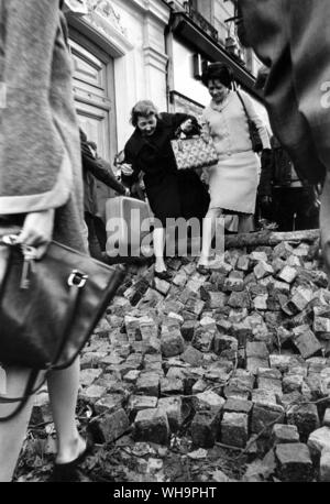 Paris Riots, 25th May 1968: Parisians scramble over piles of cobble stones torn up to build barricades with. Stock Photo