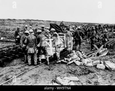 WW1/France: Battle of Vimy Ridge. Canadian and German Red Cross men despatching wounded to a dressing station on a light railway. April 1917. Stock Photo