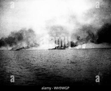 WW1/ British Battle Cruiser Lion being hit on Q turret. 13th Flotilla. T.B. Destroyers working ahead to attack. Jutland, 31st May 1916. Stock Photo