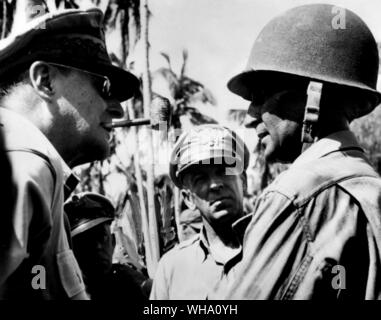 WW2: US General Douglas MacArthur discusses strategy of the Philippine campaign with Major-General Frederick A Irvin (right), commander of the US 24th Division, near Tacloban, liberated capital of Leyte Island. Stock Photo