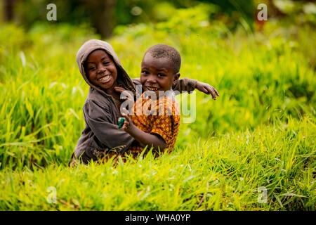 Cute kids posing in Lake Bunyonyi, Uganda, East Africa, Africa Stock Photo