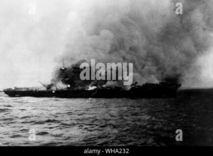 WW2: US Navy/ Burning of the USS Lexington (CV-2) following the Battle of the Coral Sea, 8th May 1942. All hands abandoned the ship, and fires started on deck and in the super-structure.. Stock Photo