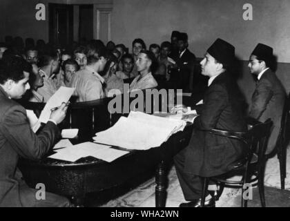 25th Feb 1955: Fifty-six soldiers escape from the French Foreign Legion returning from Indo-China. They jumped from the troopship into the Suez Canal. The Egyptian court fined them £50 for entering their country illegally. Here is the courtroom in which the legionnaires were fined at Port Said. Stock Photo