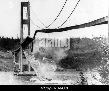 Large section of the concrete roadway in the centre span of the new Tacoma Narrows Bridge hurtled into Puget Sound November 7th 1940 High winds caused the bridge to sway, undulate and finally collapse under the strain Stock Photo