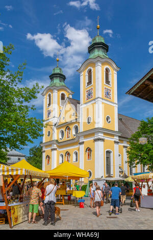 View of Church (Barocke Pfarrkirche) and market in St. Johann, Austrian Alps, Tyrol, Austria, Europe Stock Photo