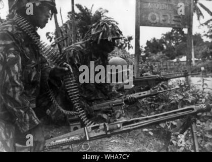 Nigerian troops on the way to Benin. Nigerias Federal Army are pictured in action stations beside a school and a church at Ore, 120 miles ease of Ibadan during their operation against secessionist Biafran forces who had invaded the western region and captured the town of Benin last week, Biafran troops were said to have intercepted last weekend near the town of Ore. 17th August 1967 Stock Photo