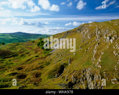 View NNW to Moel Famau (rear L) looking over mining remains below a limestone crag on Bryn Alyn between Eryrys & Llanferres in the Clwydian Range AONB Stock Photo