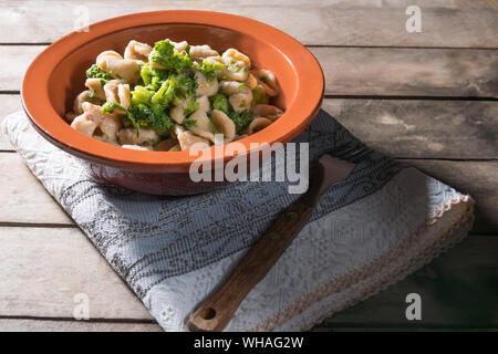 Homemade wholegrain Italian pasta, a traditional dish in Puglia, southern Italy, orecchiette with turnip greens, served in Bari Stock Photo