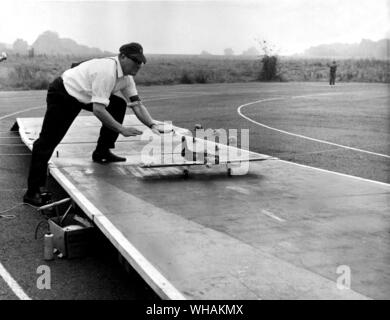 A control line model being released form a miniature flight deck Stock Photo