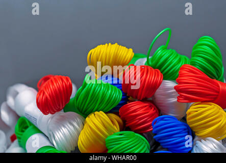 Colored plastic rope. Multicolored plastic wires in bundles. Stock Photo