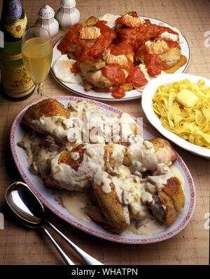 International Cooking . Top Chicken Marengo.. France Or Italy.. Bottom, Alsace-Style coq Au Vin.. Coq Saute Au Riesling, France. Stock Photo