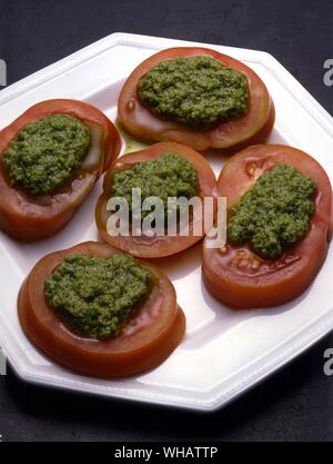 Italian Cooking By Robin Howe. . Pomodori Alla Salsa Verde.. Tomatoes With A Green Sauce. Stock Photo
