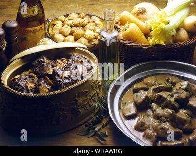 Italian Cooking By Robin Howe. . Left.. Lepre Alla Marengo.. Hare Marengo.. . Right. . Camoscio In Civet.. Civet Of Venison. Stock Photo