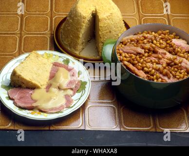 Beans and Bacon. Ham Knuckle with Pease Pudding Stock Photo
