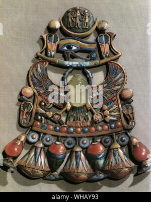 Pectoral in gold cloisonne decorated with semi precious stones and glass paste, found in Tutankhamun's tomb. In the centre is the winged scarab, symbol of resurrection and the rising sun god. Tukankhamen, by Christiane Desroches Noblecourt, page 172. Stock Photo