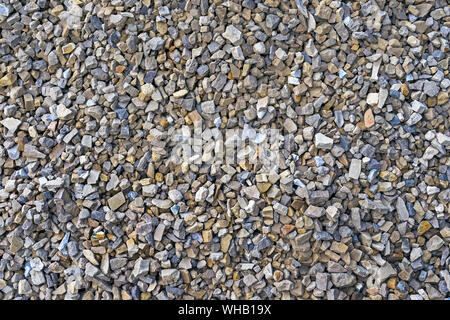 Rubble. Texture and background of crushed stone, pebbles, gravel. Crushed stone. Stock Photo