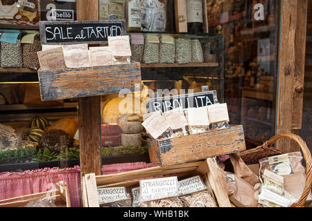 AREZZO, TUSCANY, ITALY - JANUARY 10, 2016: Typical Italian products displayed on the storefront of Antica Bottega Toscana, one of the oldest shops Stock Photo