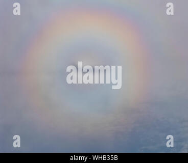 Circular rainbow. Halo seen from an aircraft with the aircrafts shadow in the centre Stock Photo