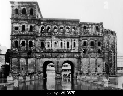 Porta Nigra is a city gate, part of the Roman architecture in Trier, west Germany. Viewed from the Town side, from the north. Built from grey sandstone between 180 and 200 AD.. . . Stock Photo