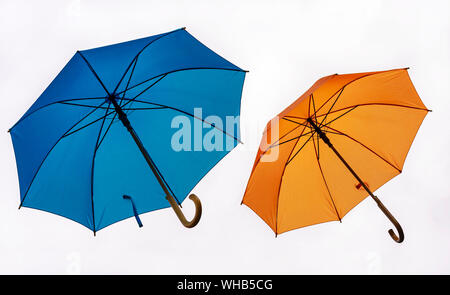 Two colorful umbrellas on a white background. Stock Photo