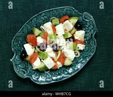 Greek salad with Feta cheese, olives, cucumber, celery, tomatoes, onions.. Stock Photo