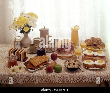 Array of food on lace tablecloth. Stock Photo