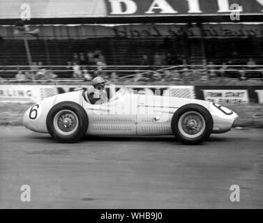 Prince Bira driving a Maserati during practice at Silverstone for the British Grand Prix. 16 July 1954 Stock Photo