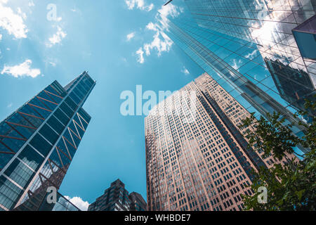 Skyscrapers, point of view from under to top, with reflections of clouds in the windows, center of city of  Philadelphia, USA