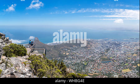 Tourists at a viewpoint on Table Mountain overlooking the city of Cape Town, South Africa Stock Photo