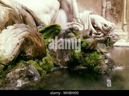 Hand detail of Marforio and face sculpture covered with moss , in the courtyard of the Capitoline Museum , Rome , Italy . . Stock Photo