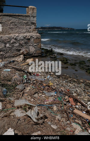 Plastic waste along the shoreline of Zakynthos island showing the environmental impact plastic is having in polluting the worlds oceans. Stock Photo