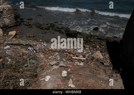 Plastic waste along the shoreline of Zakynthos island showing the environmental impact plastic is having in polluting the worlds oceans. Stock Photo
