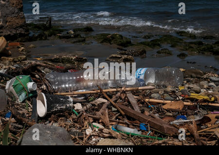 Plastic waste along the shoreline of Zakynthos island showing the environmental impact plastic is having in polluting the worlds oceans. Stock Photo