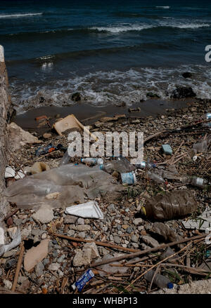 Plastic waste along the shoreline of Zakynthos island showing the environmental impact plastic is having in polluting the worlds oceans. Stock Photo