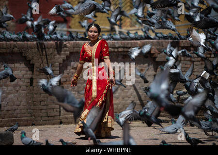 Kathmandu, Nepal. 02nd Sep, 2019. A girl chases a pigeons at the premises of Pashupatinath temple duing a Teej festival in Kathmandu, Nepal on Monday 2 September 2019.During this festival, Hindu women observe a day-long fast and pray for their husbands and for a happy married life. Those who are unmarried pray for a good husband. (Photo by Prabin Ranabhat/Pacific Press) Credit: Pacific Press Agency/Alamy Live News Stock Photo