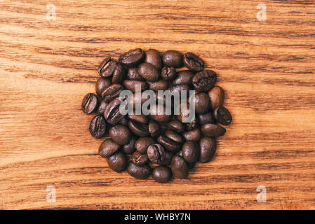 A cup of coffee and scattered coffee beans. Layout. Flat lay. Coffee bean Stock Photo