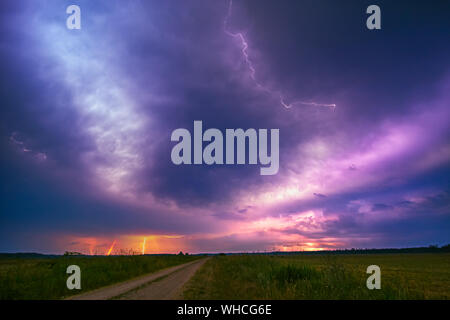 Lightning with dramatic clouds composite image . Night thunder-storm Stock Photo