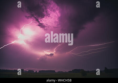 Lightning with dramatic clouds composite image . Night thunder-storm Stock Photo