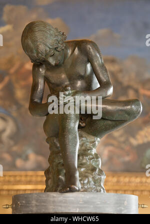 Boy with Thorn, bronze statue in Capitoline Museums, Rome, Italy. 1st century BC Stock Photo