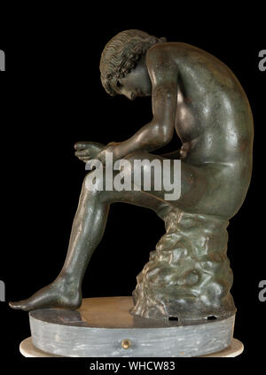 Boy with Thorn, bronze statue in Capitoline Museums, isolated, Rome, Italy. 1st century BC Stock Photo