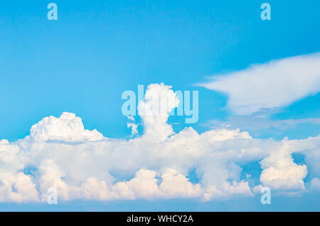 White clouds on a background of blue sky. Background image. Place for text. Stock Photo