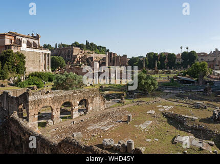 Forum of Nerva (foreground), Temple of Faustina and Antonius Pios (left), Domus Tiberiana. Rome, Italy Stock Photo