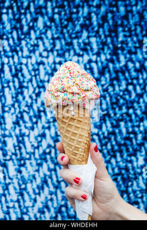 Nude woman with sprinkles eating ice cream Stock Photo - Alamy